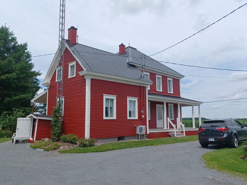 Peinture extérieure — Maison rouge revetement 01 à Sorel‑Tracy